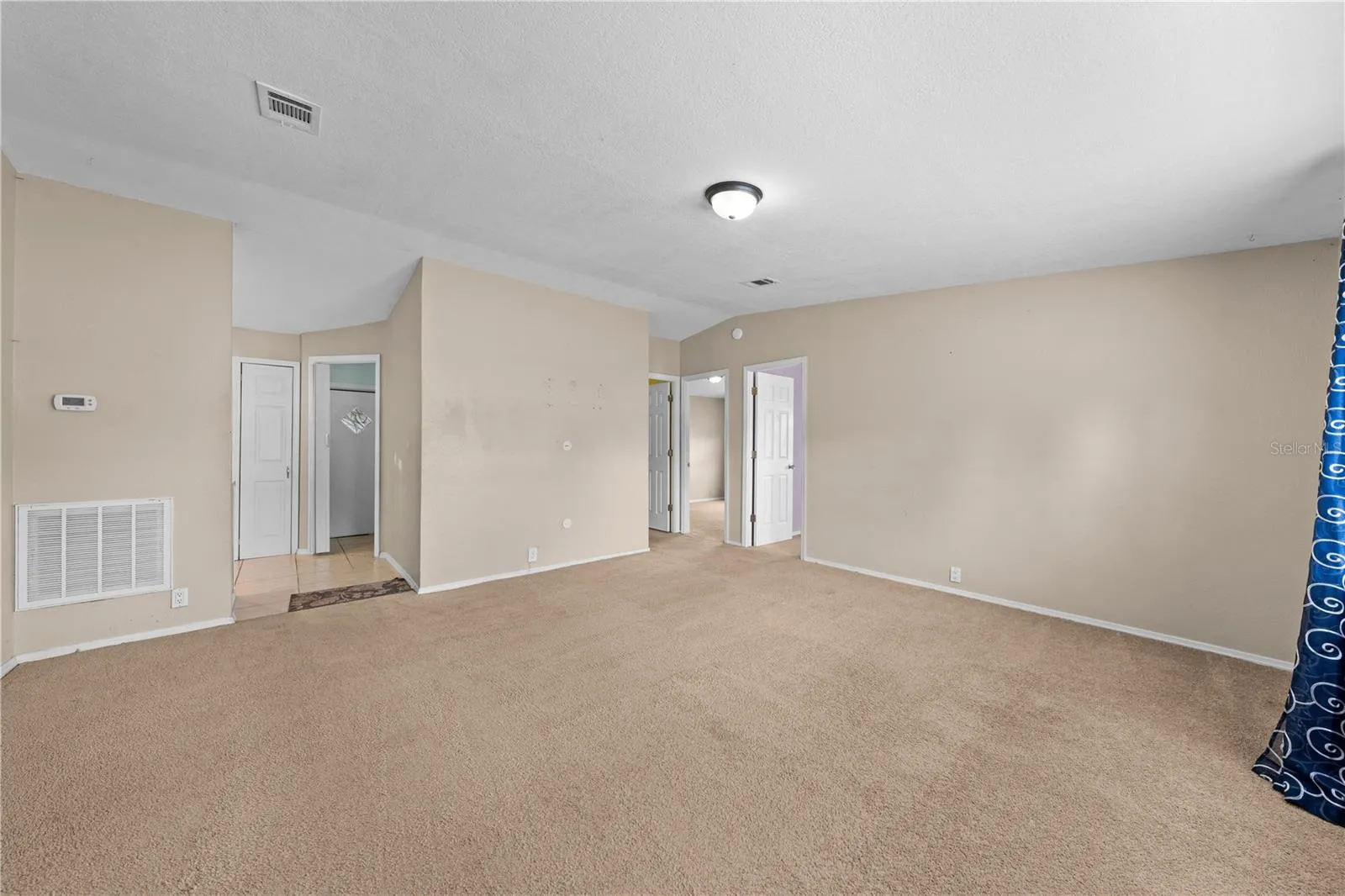 Family room facing the kitchen and bedrooms
