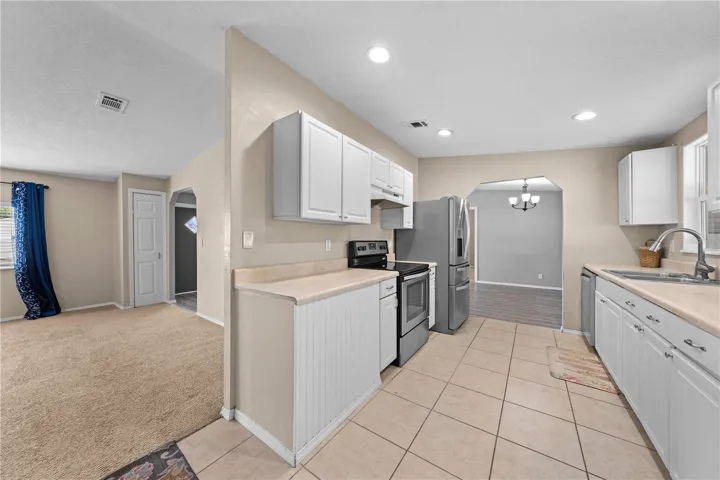 Kitchen with family room to the left and dining room straight ahead