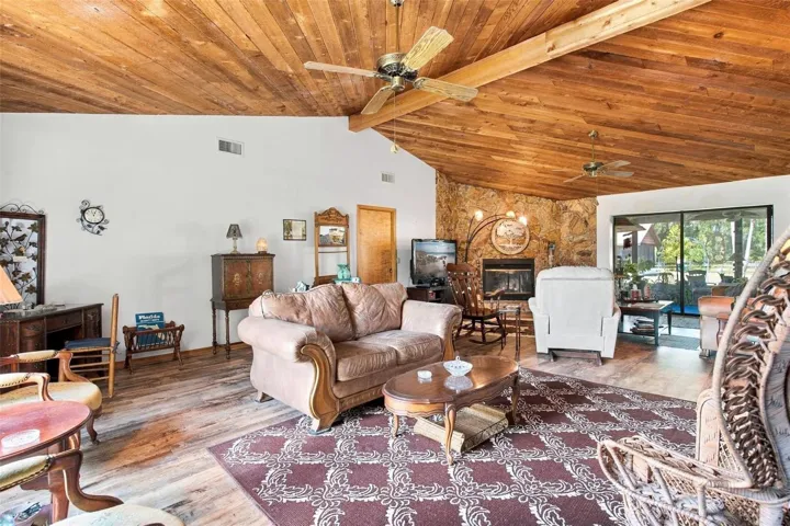 Living room with vaulted cedar ceilings.