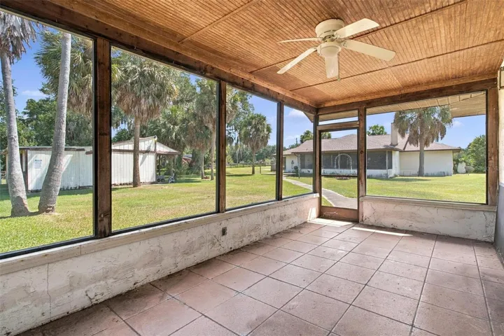 Screen enclosed back porch.
