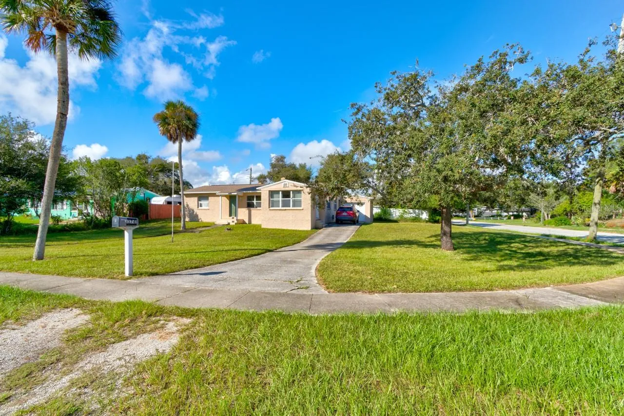 Front and side of home on large corner lot