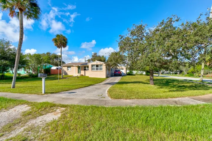 Front and side of home on large corner lot