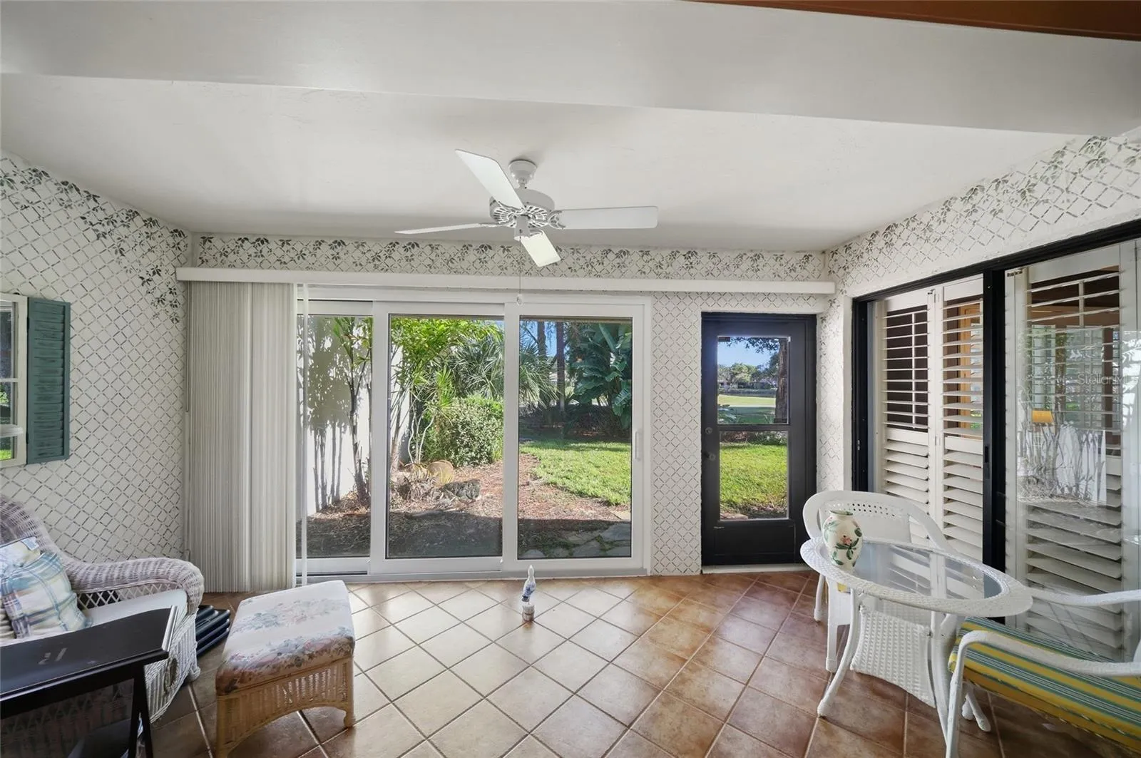 Sunroom leading to backyard