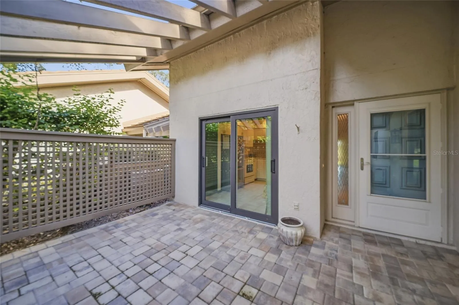 Front courtyard space with Sliding Glass Door to kitchen
