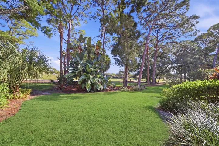 Spacious backyard and lawn looking out to the golf course