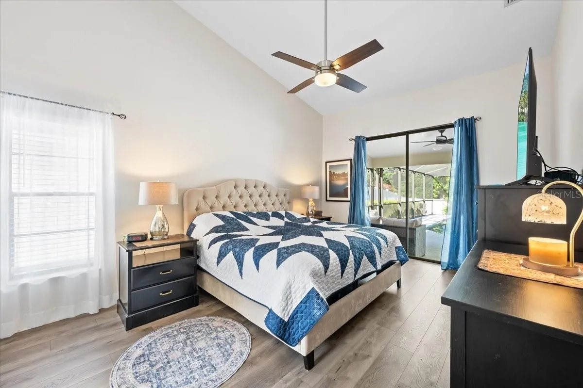 Primary Bedroom with Porch and Pool View