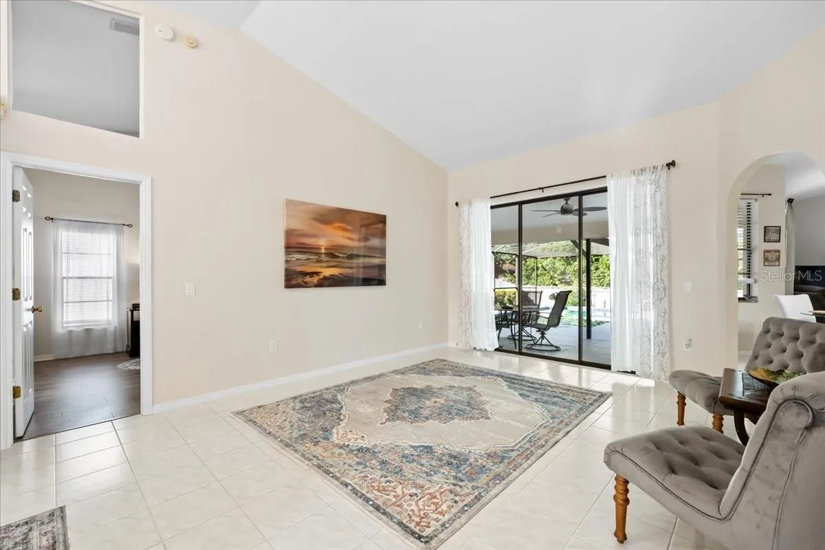 Living Room with Porch and Swimming Pool View