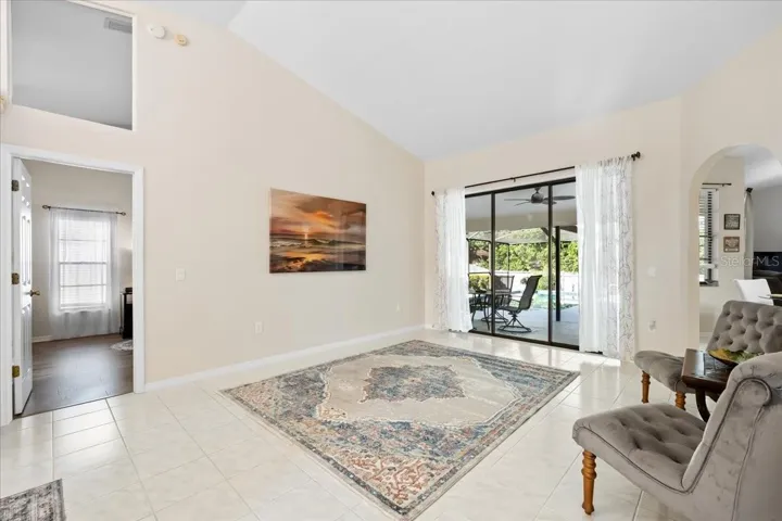 Living Room with Porch and Swimming Pool View