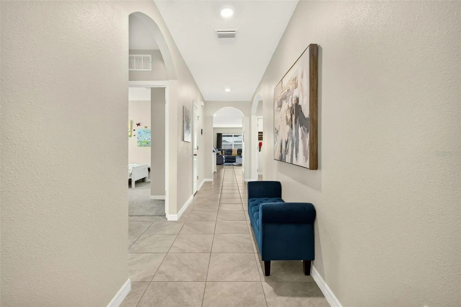Spacious entry way with 2 bedrooms and a full bath to the front of the home