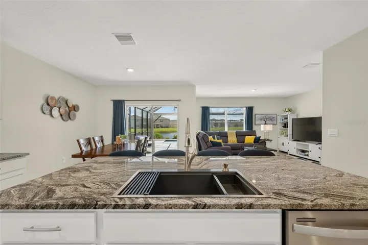 Abundant courter space and work space; large center island with drop-in farm sink