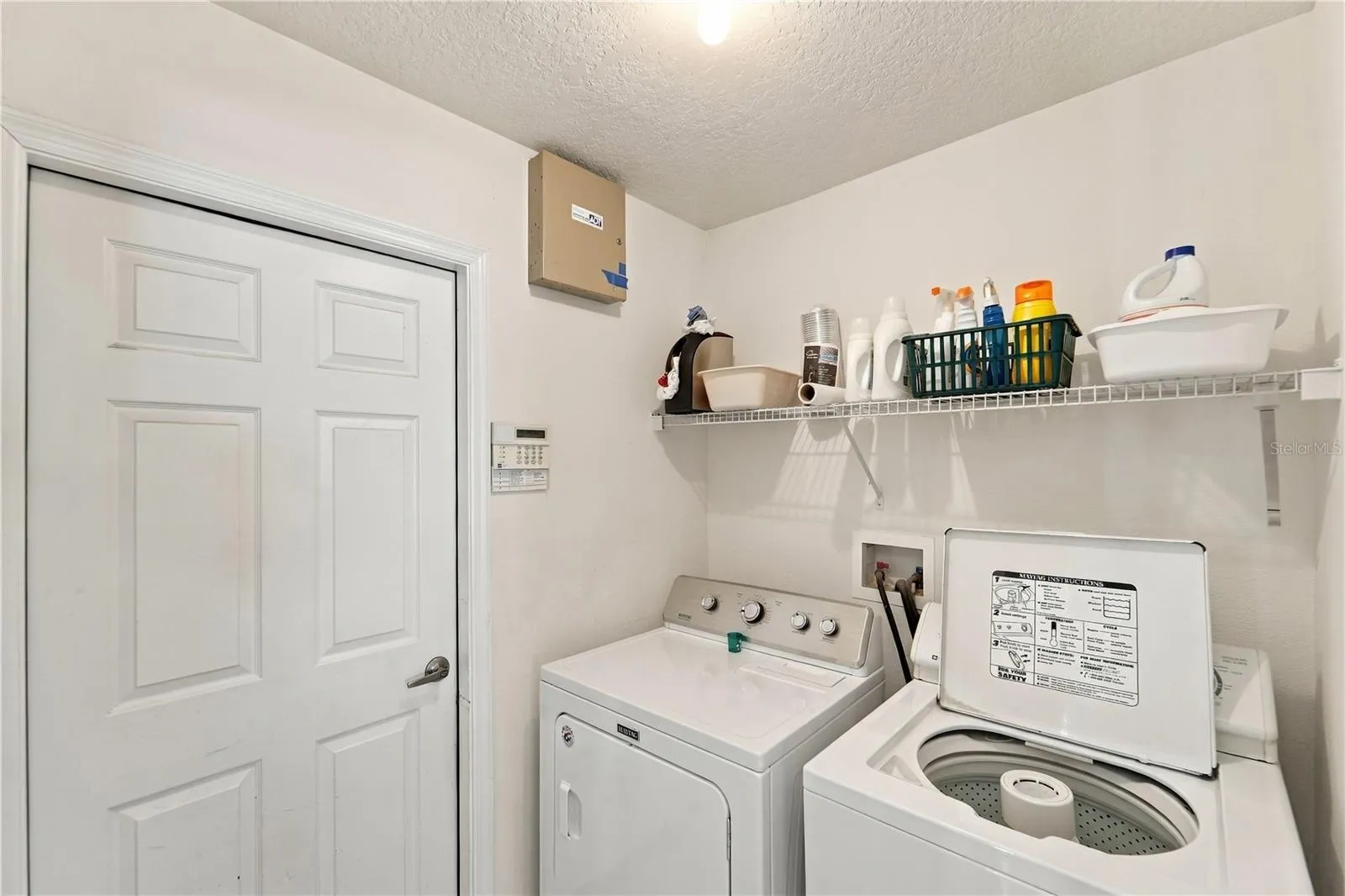Separate laundry room accessed from kitchen.