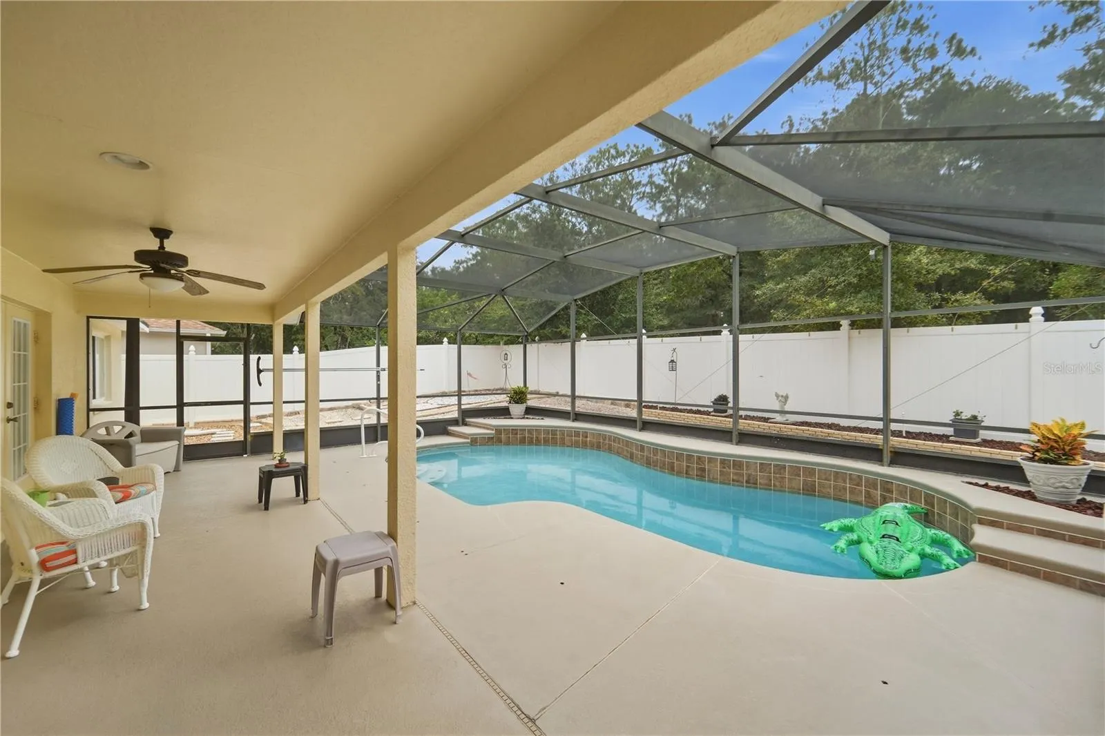 Covered and screened pool deck for entertaining!