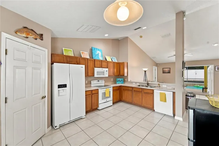 Kitchen looking towards family room and pool