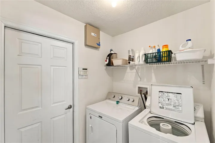 Separate laundry room accessed from kitchen.