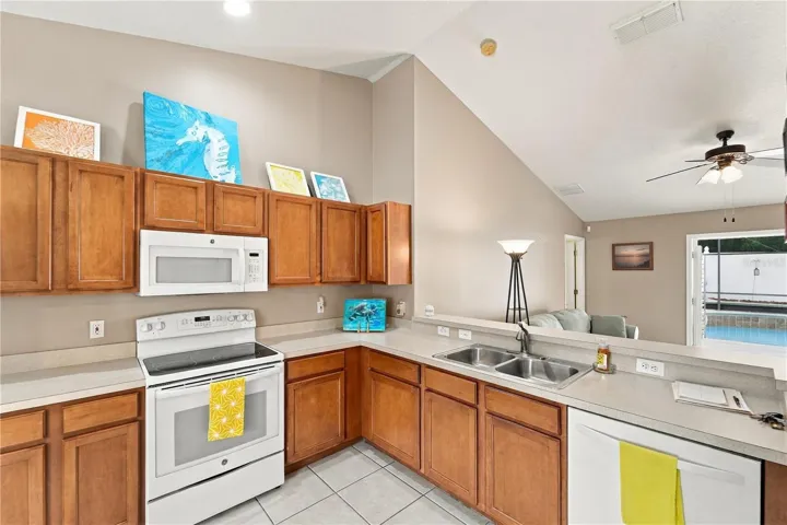 Kitchen is well designed so you can check on your guests in the pool area