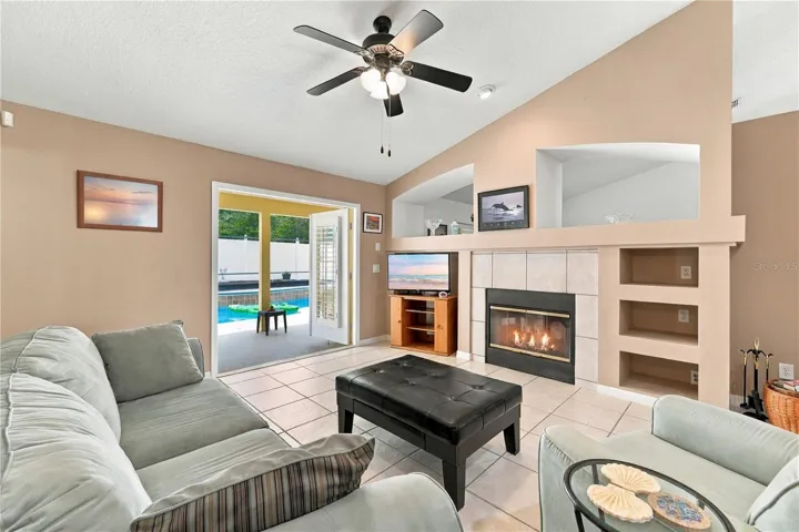 Family room with French doors open to the pool area.