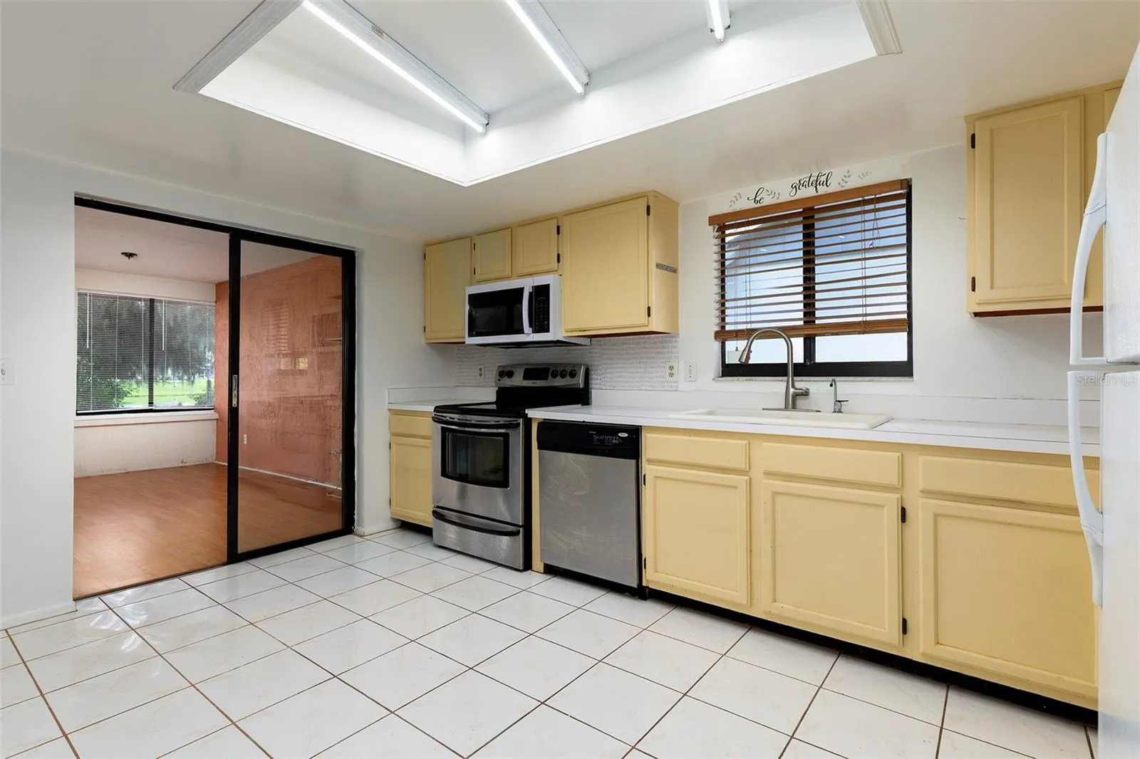 Kitchen to oversized Sunroom