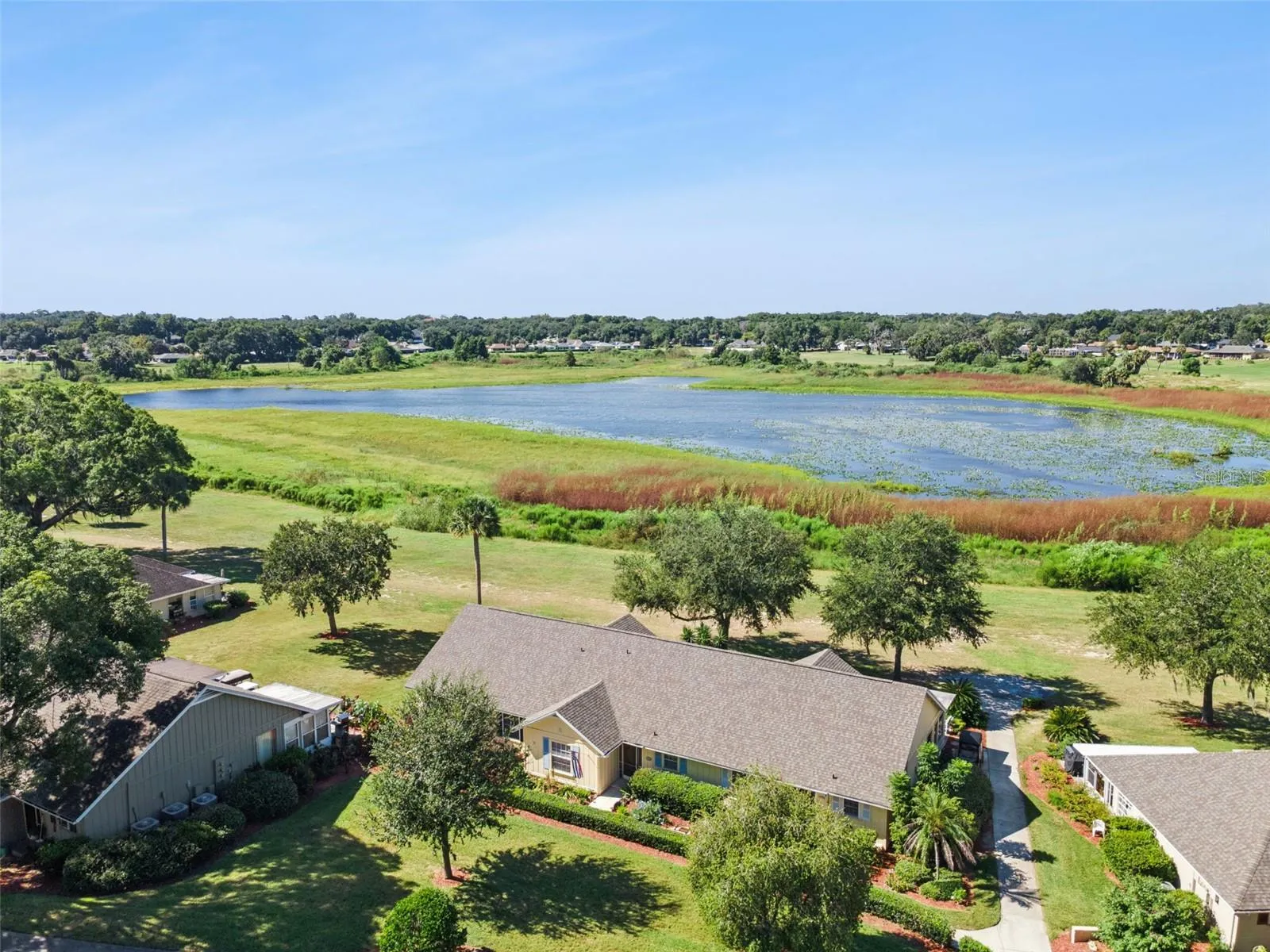 This move-in-ready home offers maintenance-free living and sumptuous sunsets over Lake Alden with no rear neighbors: priceless!