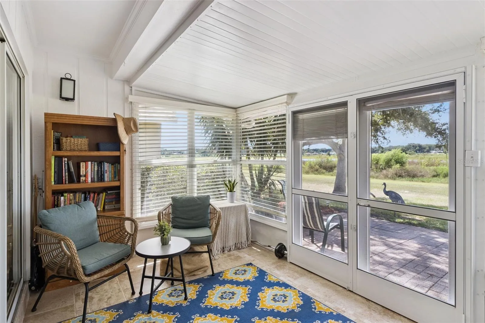 French doors with center-opening screens lead to the patio when you want the breeze.