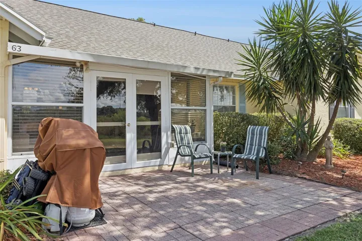 Fabulous Florida foliage flanks the oversized paver patio.
