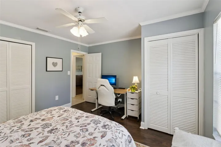 Secondary bedroom has two closets and no carpet.