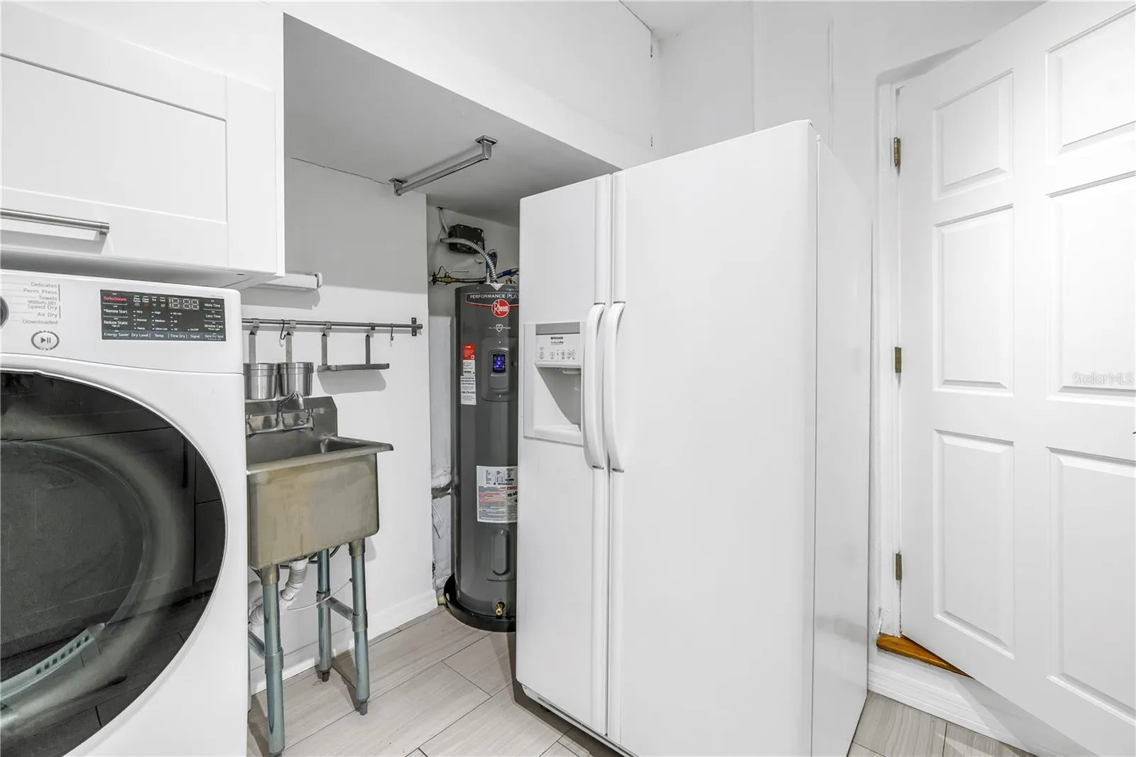 Brand new high-efficiency, whole-house smart water heater.  Beverage or additional capacity refrigerator