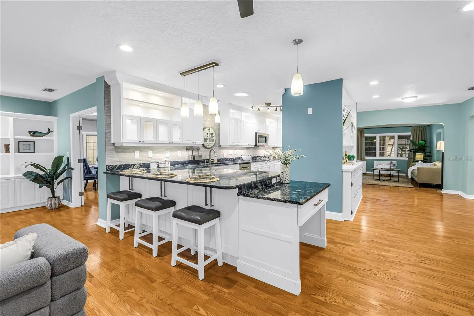 Modern lighting, illuminated cabinetry, sun tubes for natural light, and a dedicated built-in study/management area.