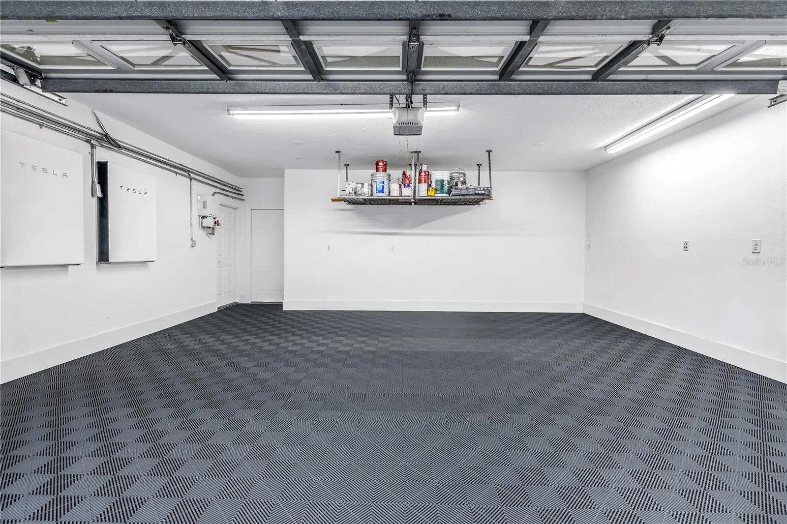Pristine Garage Space with heavy duty matting for cars, workout or projects