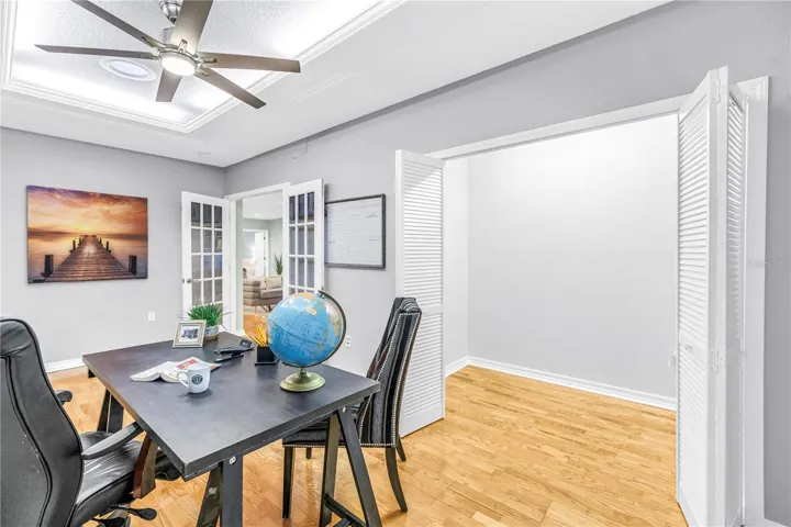 The fourth bedroom is currently utilized as an executive office, featuring a tray ceiling and an oversized closet.