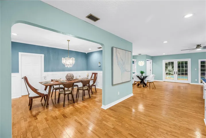 This open-concept dining area flows seamlessly into the surrounding living spaces, perfect for more social gathering