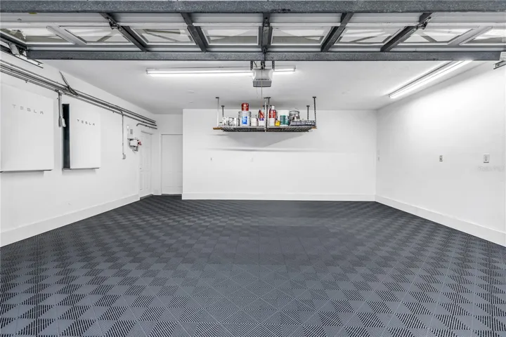 Pristine Garage Space with heavy duty matting for cars, workout or projects