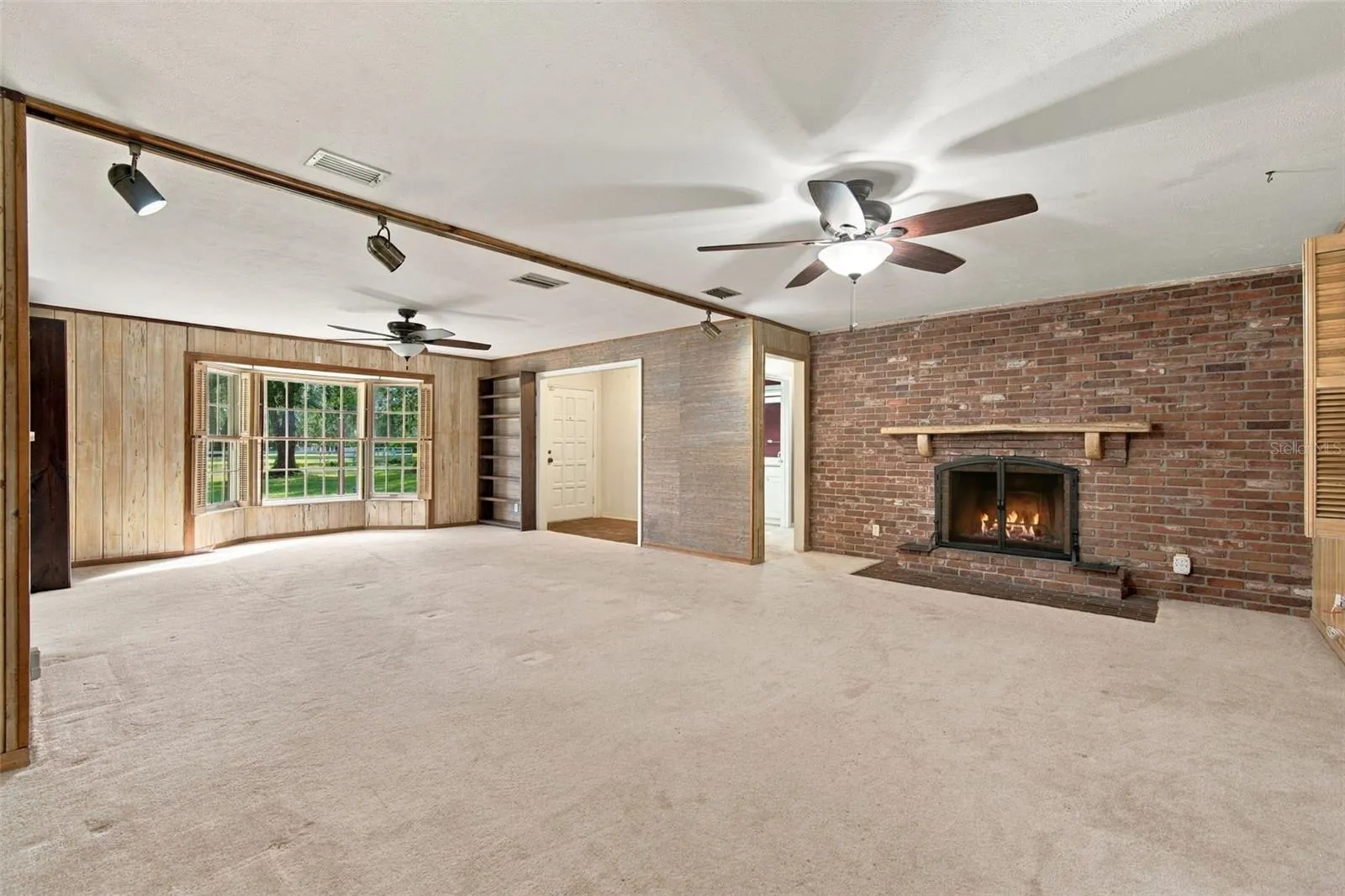 Living room with wood burning fireplace