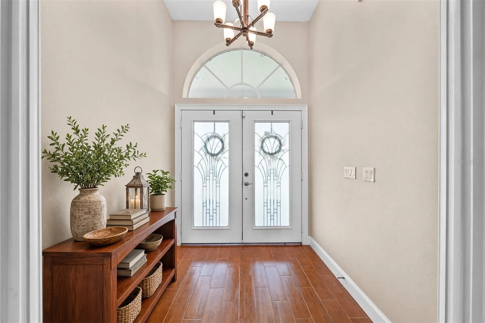 Double Entry Front Exterior Doors with lots of natural light.