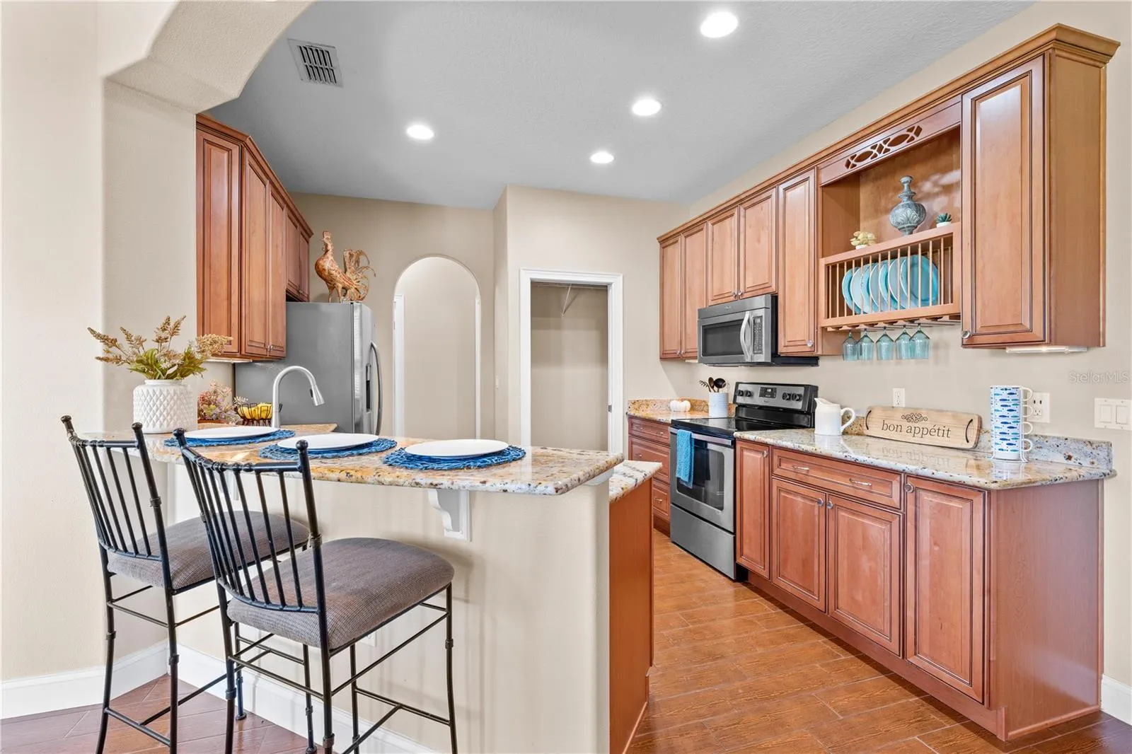 Custom Cabinets and Granite Countertops in the Kitchen.