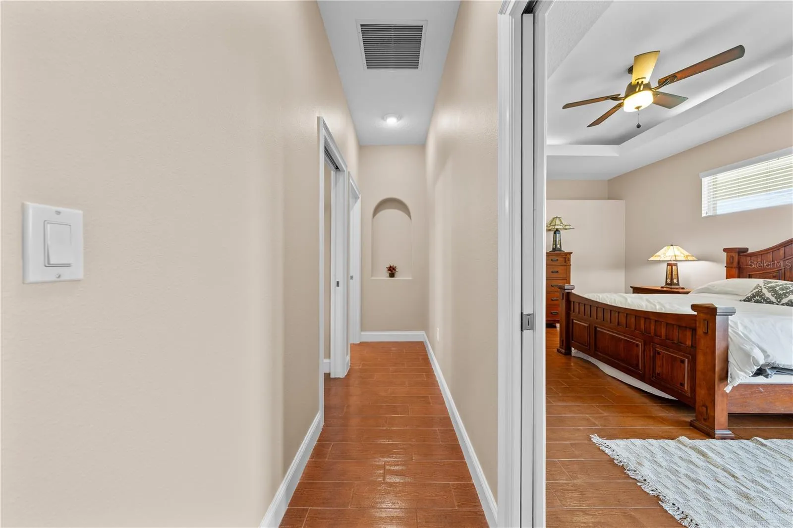 Hallway that leads to the Primary Bedroom, Guest Bedroom and Guest 1/2 bathroom.