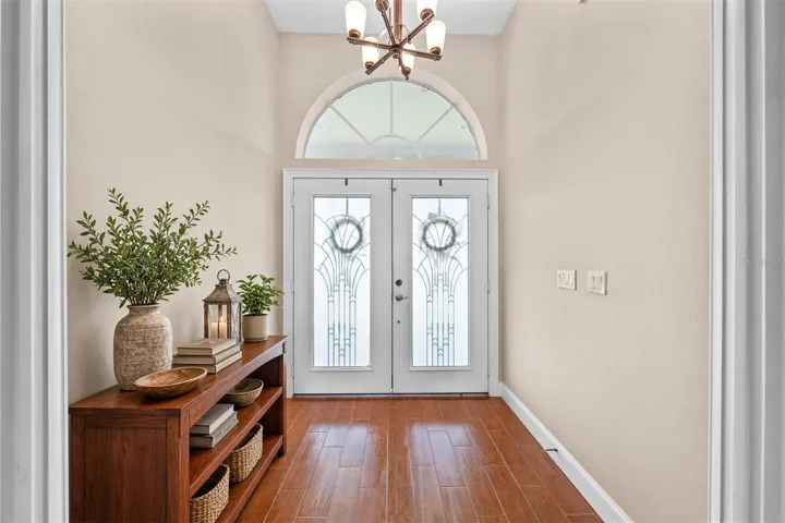 Double Entry Front Exterior Doors with lots of natural light.