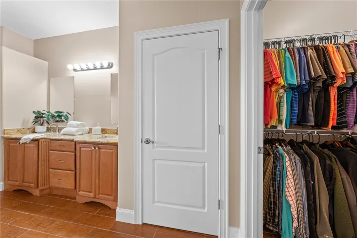 Primary Bathroom with linen closet and walk in closet.