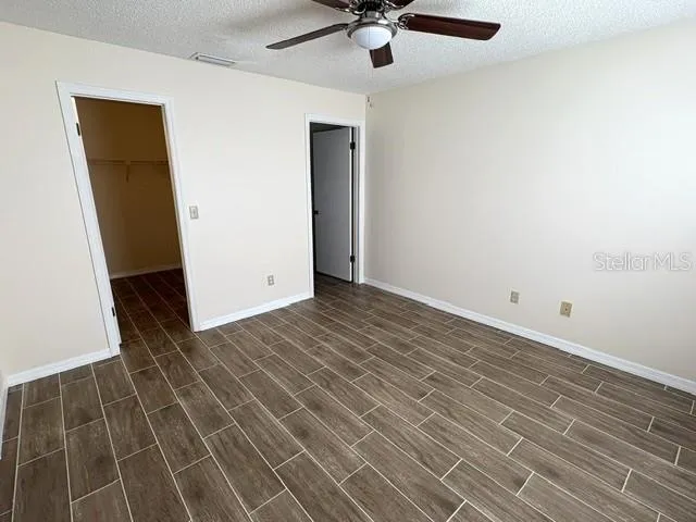 Primary bedroom with walk in closet and bathroom.