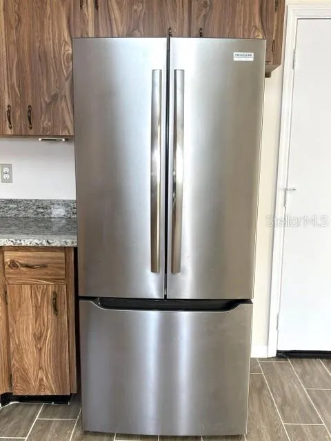 Frigidaire side by side with freezer drawer.