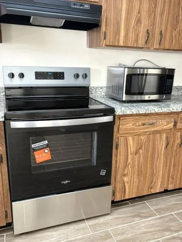 Whirlpool range with hood.