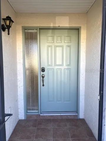 Front entrance is covered and screened.