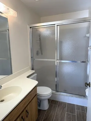 Primary bathroom with step in shower.
