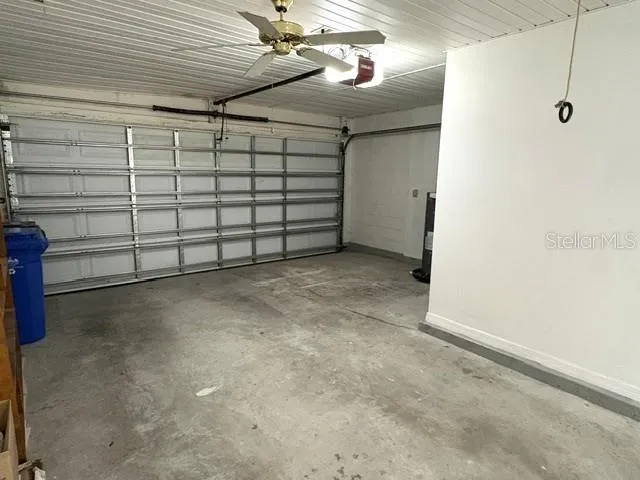 Garage with room for one car and a golf cart.