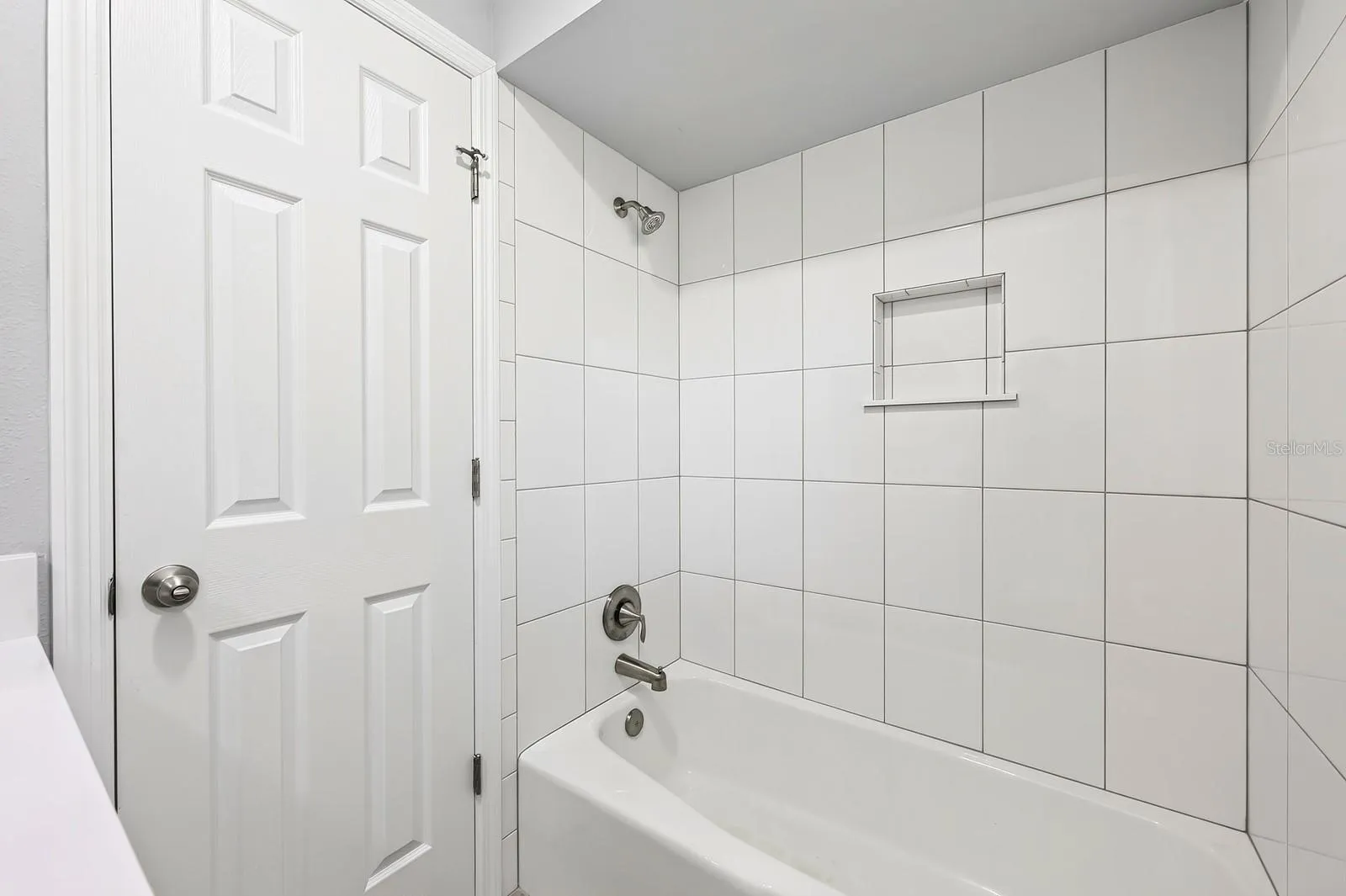 Guest bath has a shower/tub combo.