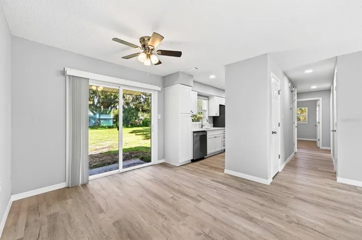 The Dining room opens into the kitchen with sliding glass door to the backyard.