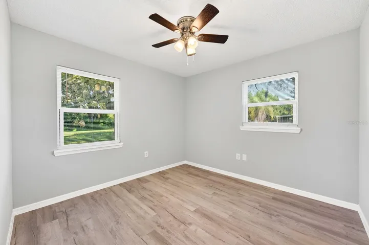 Guest bedroom 3 with a ceiling fan.