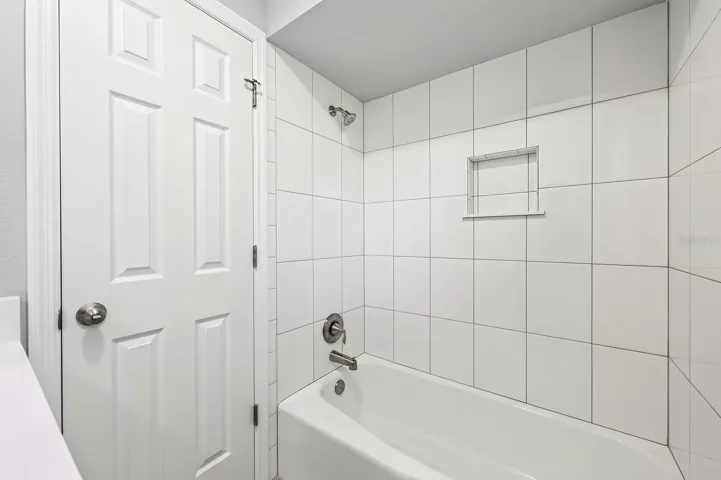 Guest bath has a shower/tub combo.