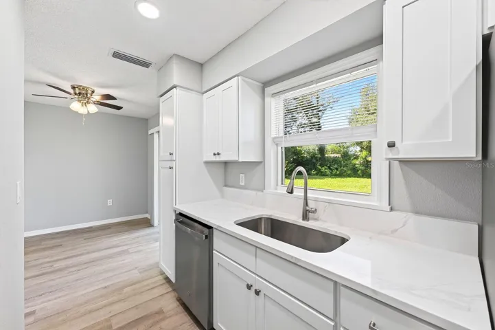 Decorative hardware makes cooking a breeze in this cozy kitchen.