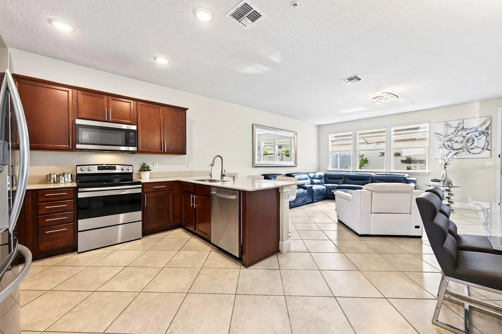 Your OPEN-CONCEPT living/dining/kitchen for comfortable family living
