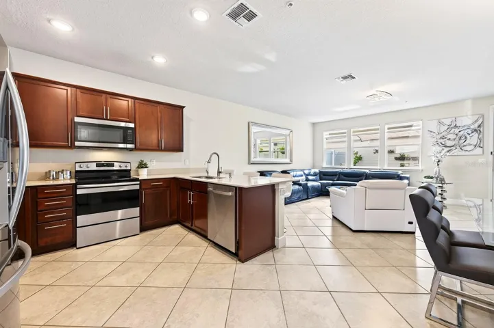 Your OPEN-CONCEPT living/dining/kitchen for comfortable family living